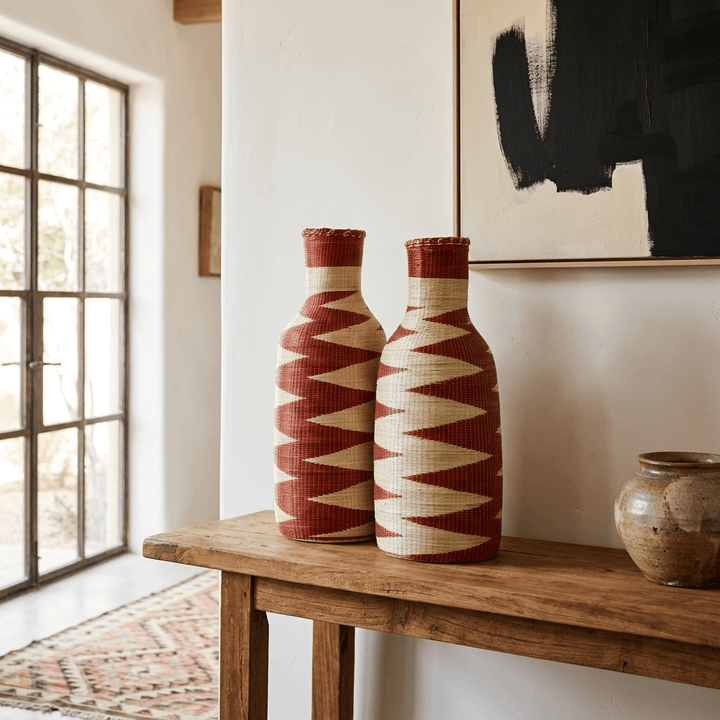 Crimson zigzag Rwandan Agaseke bottle vessel pair III — fuller body proportion