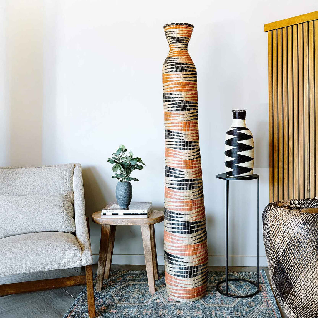 Tall woven basket tower with black shadow patterns by Rwandan artisans from Southern and Eastern Rwanda