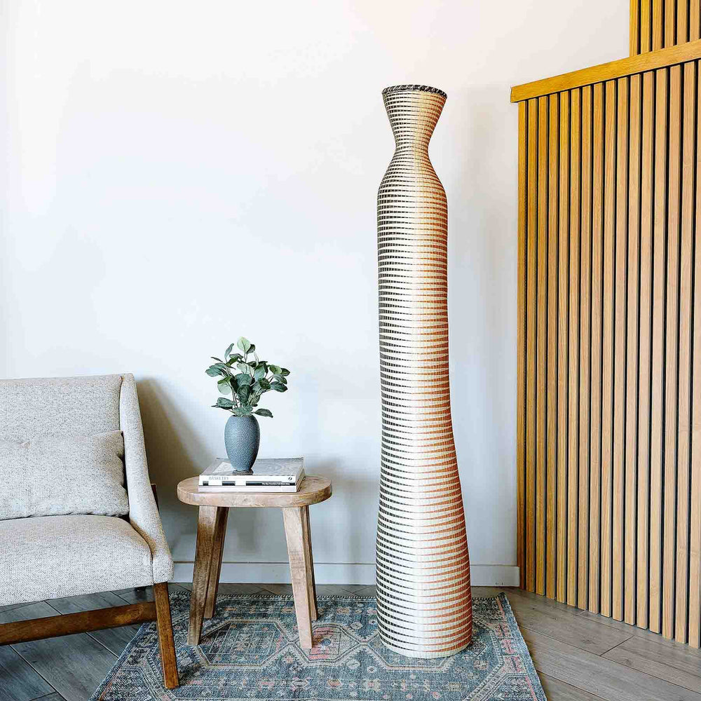 Terra Wave Column basket displayed as accent floor decor in modern minimalist interior