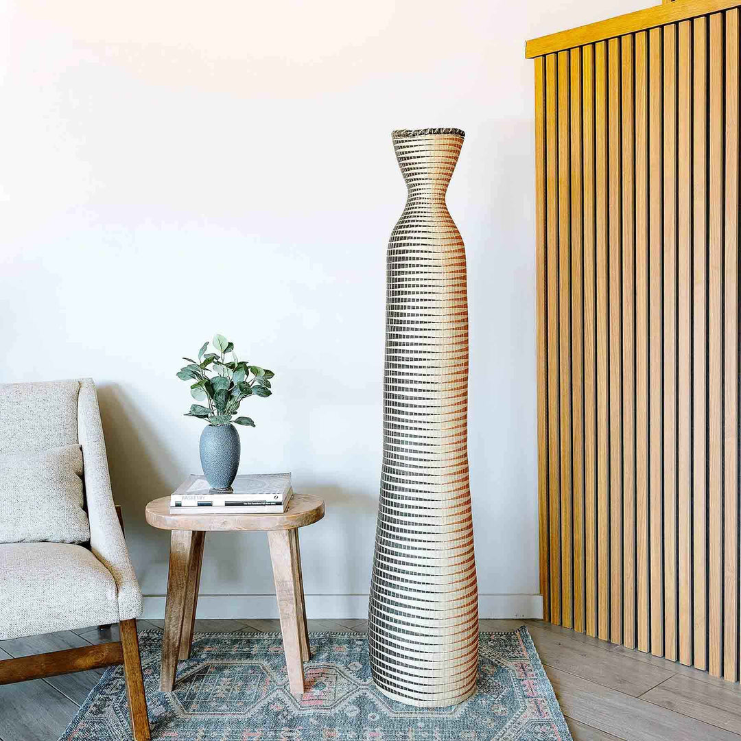 Tall golden ombre woven basket with spiral design by Rwandan artisans, large decorative tower basket in elephant grass