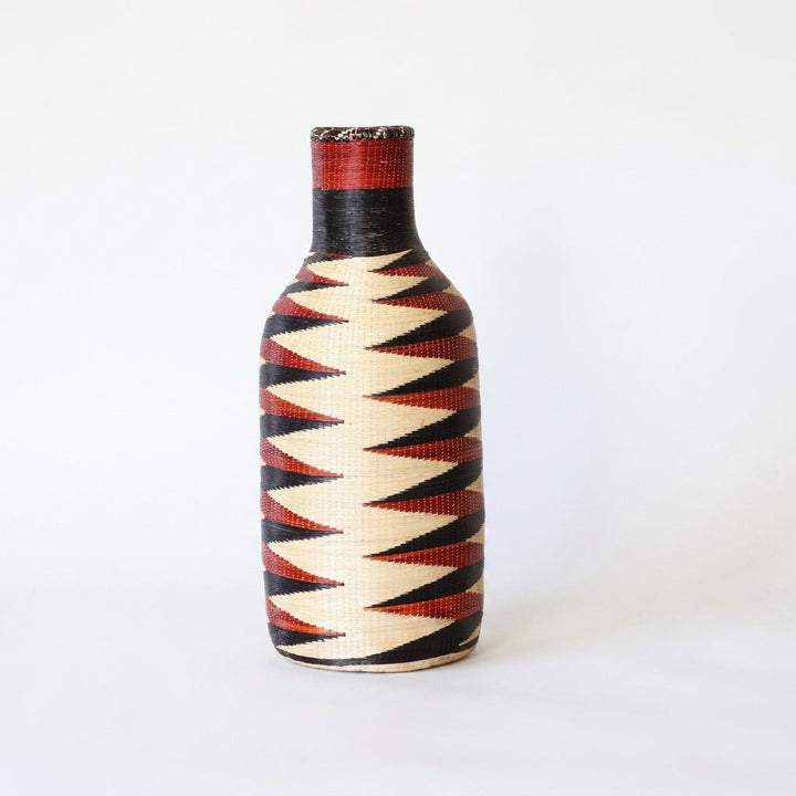 Nyanza bottle basket with red and black zigzag band, alternate angle on white