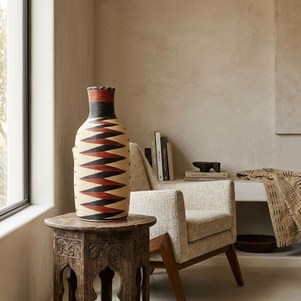 Red and black zigzag Nyanza bottle basket styled in an interior