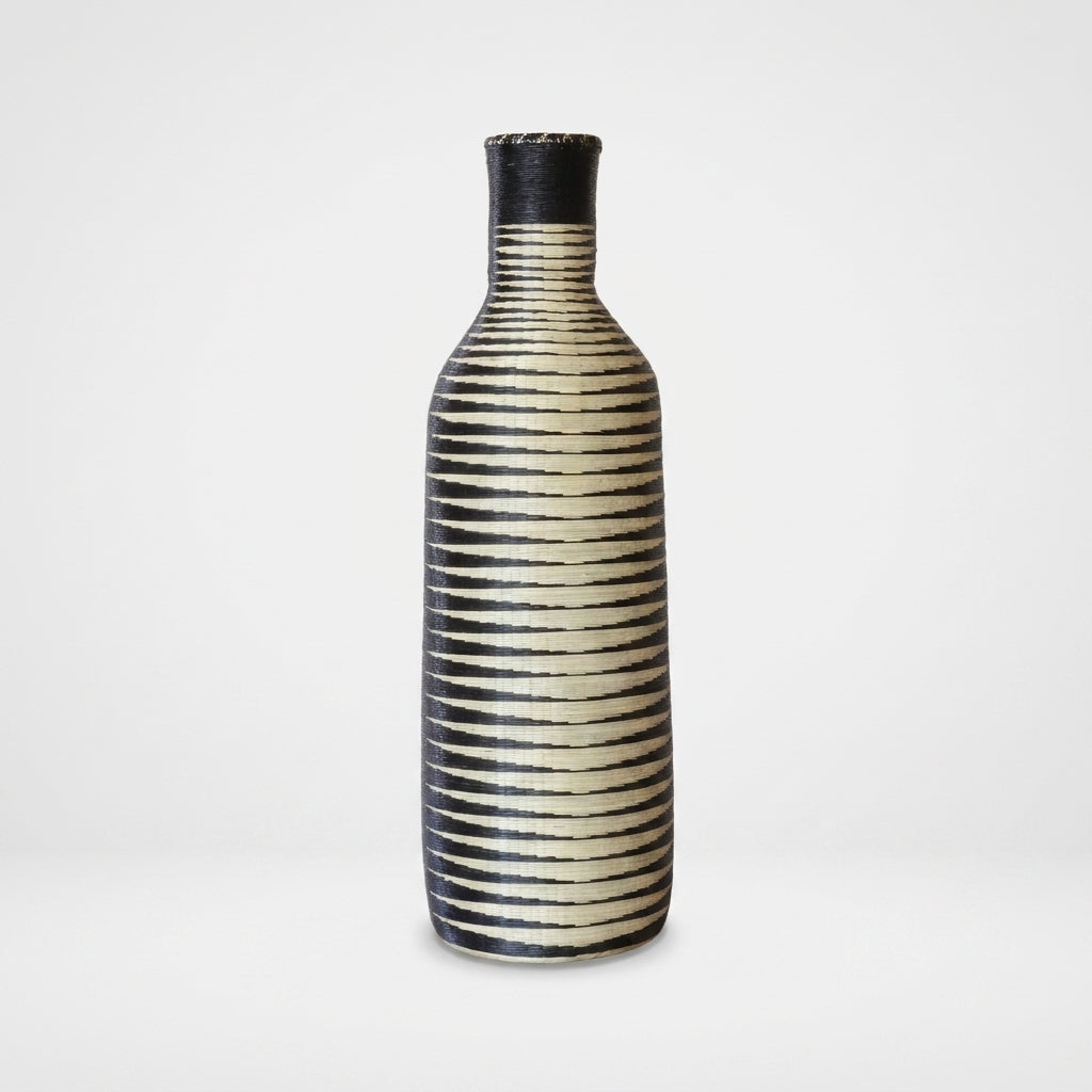 Tall Nyanza bottle basket with fine black and cream ripple stripes, on white