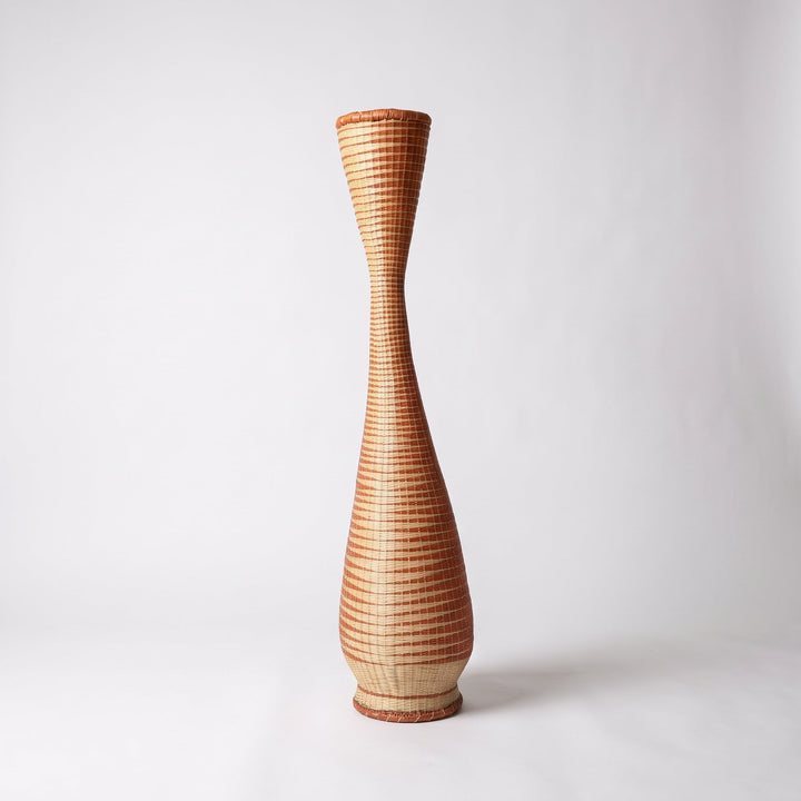 Copper and cream hourglass tower basket on soft white studio background