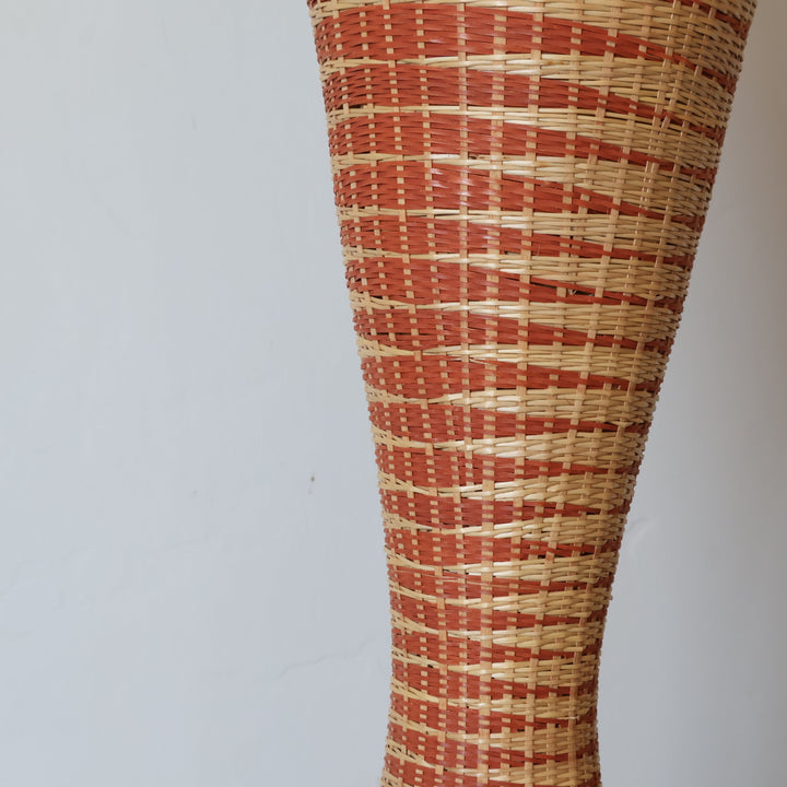 Close detail of the copper and cream grid weave on the hourglass tower basket
