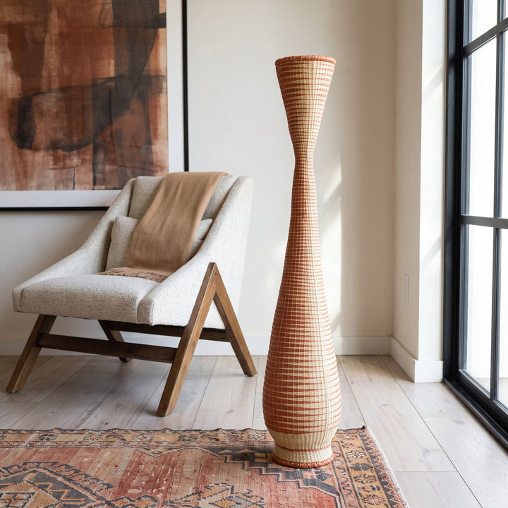 Ombre copper tower basket styled in a modern living room