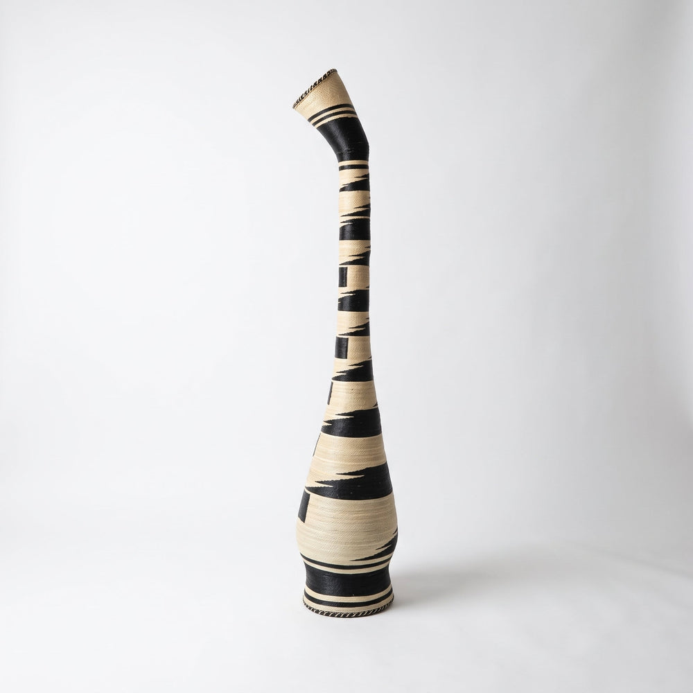 Black and cream swan neck tower basket on soft white studio background