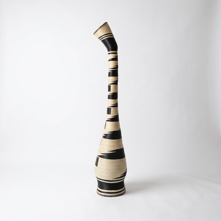 Black and cream swan neck tower basket on soft white studio background