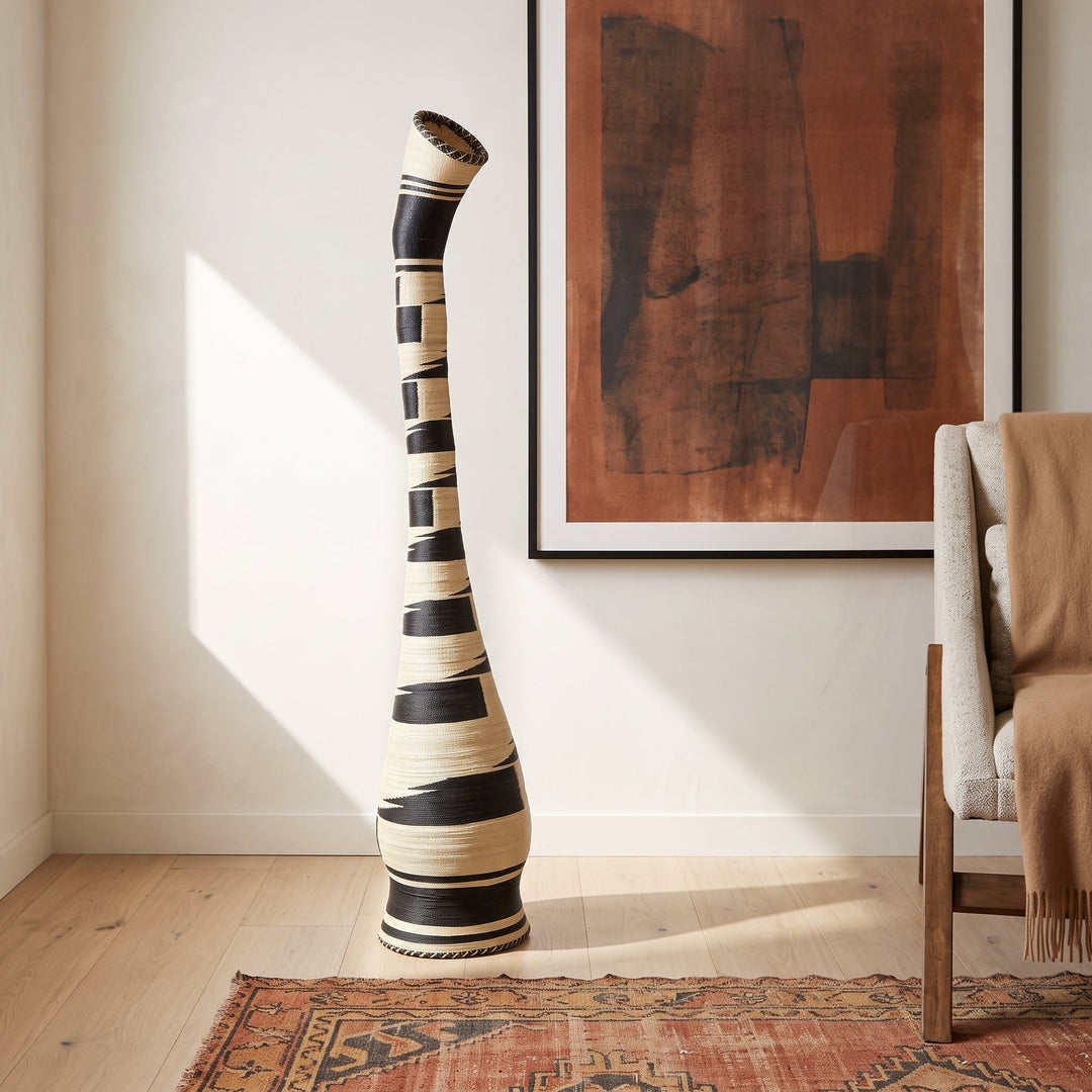 Black and cream swan neck tower basket styled in a modern living room
