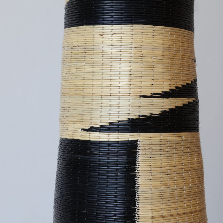 Close detail of the torn black bands on the swan neck tower basket