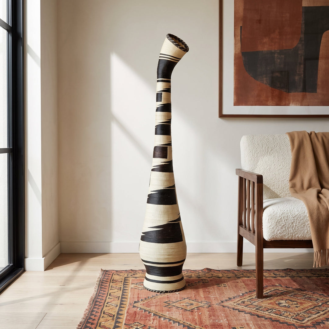 Black brushstroke tower basket styled in a modern living room