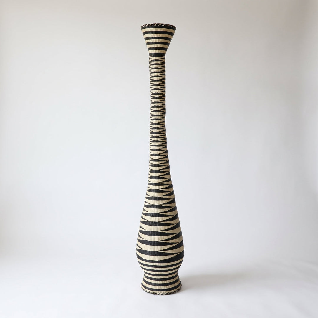 Black and cream zigzag tower basket on soft white studio background