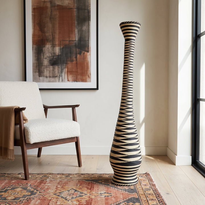 Black and cream zigzag tower basket styled in a modern living room