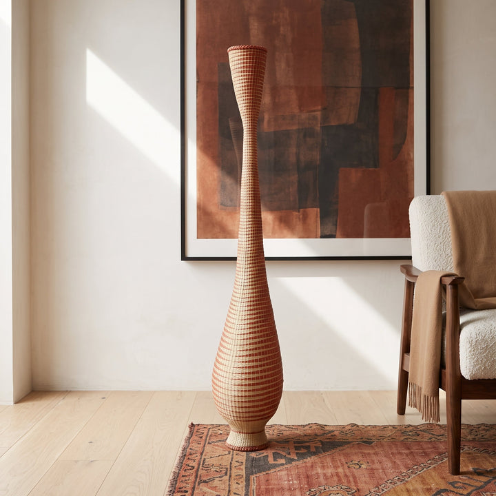Copper grid tower basket styled in a modern living room