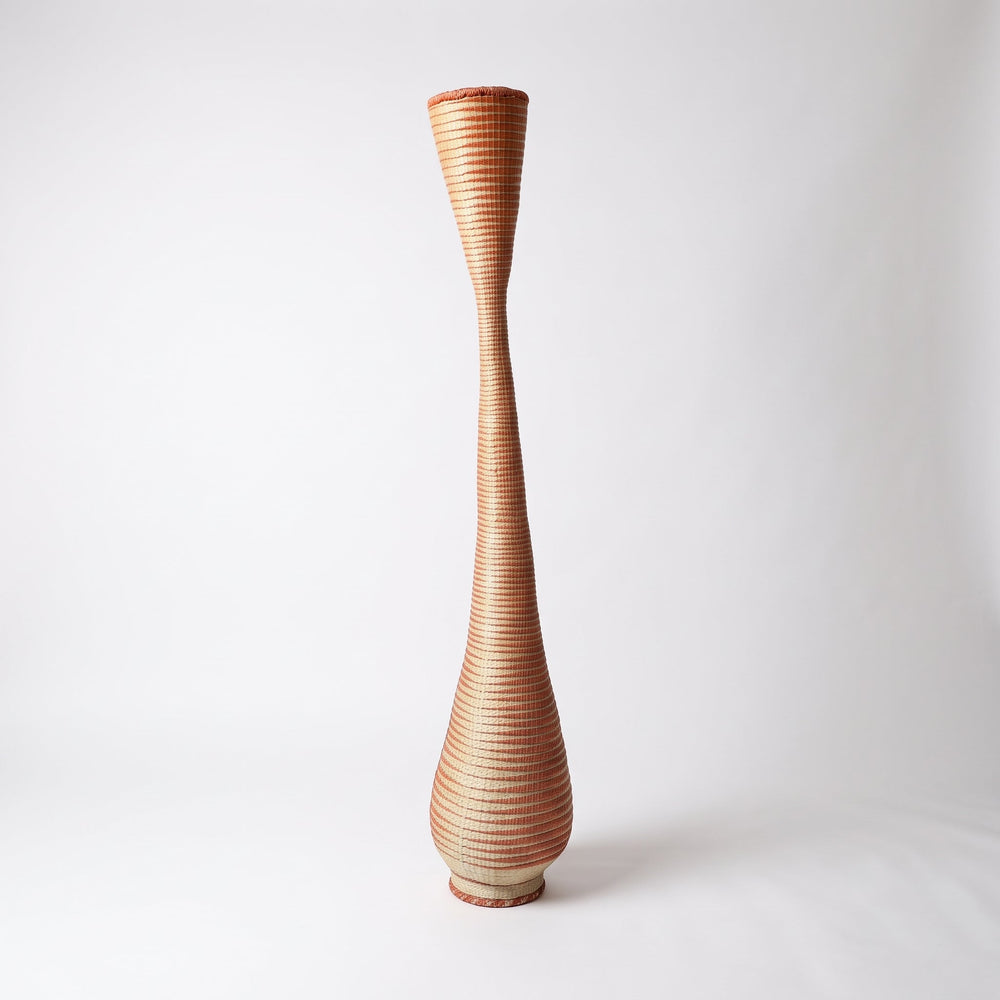 Copper spiral twist tower basket on soft white studio background