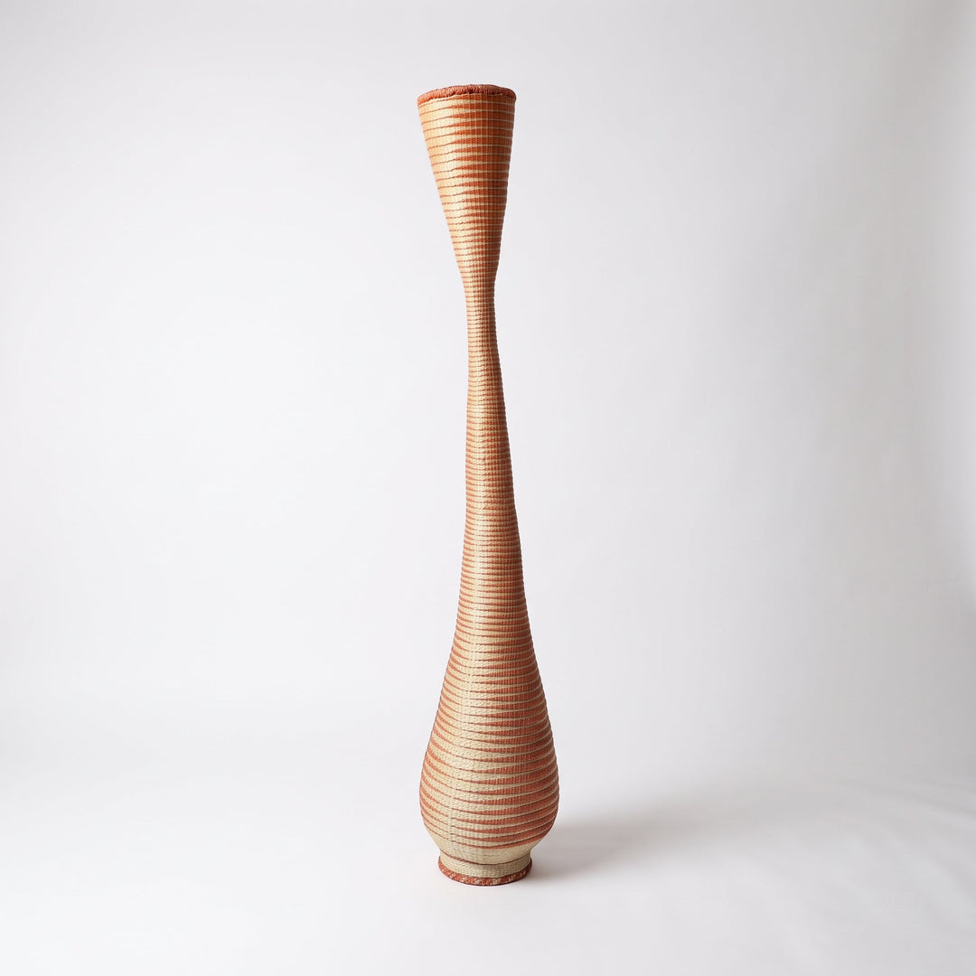 Copper spiral twist tower basket on soft white studio background