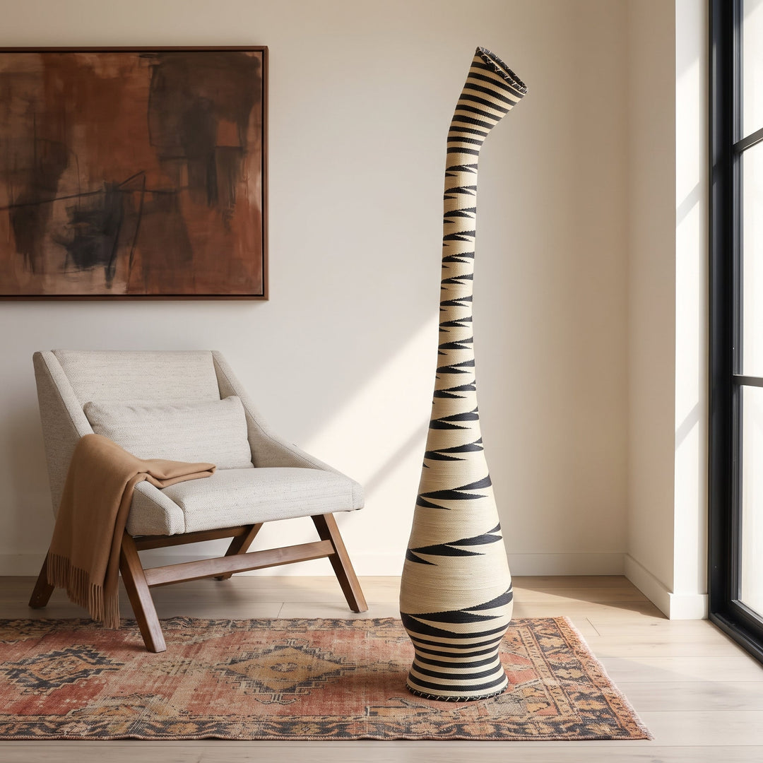 Black sawtooth swan neck tower basket styled in a modern living room