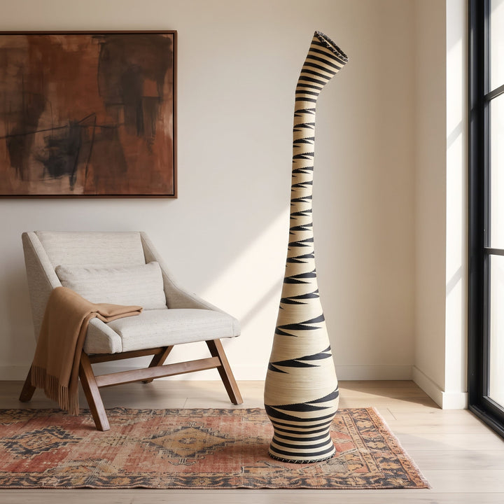 Black sawtooth swan neck tower basket styled in a modern living room