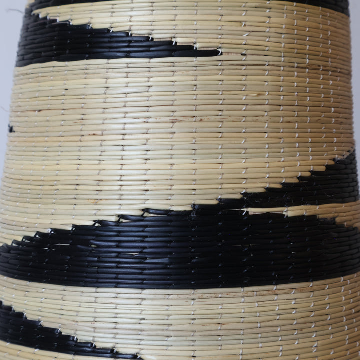 Close detail of the black sawtooth flames on the swan neck tower basket