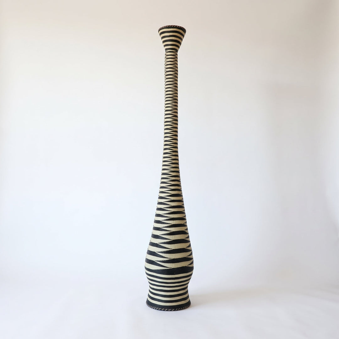 Black and cream ripple tower basket on soft white studio background