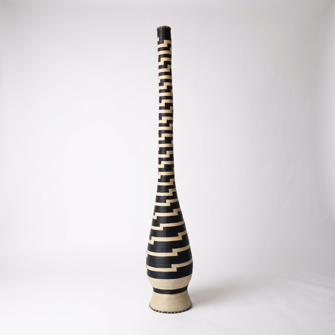 Stepped black and cream tower basket, alternate angle on soft white studio background