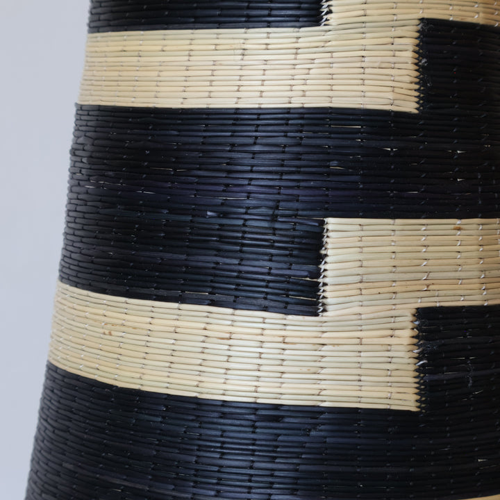 Close detail of the stepped black blocks on the tower basket