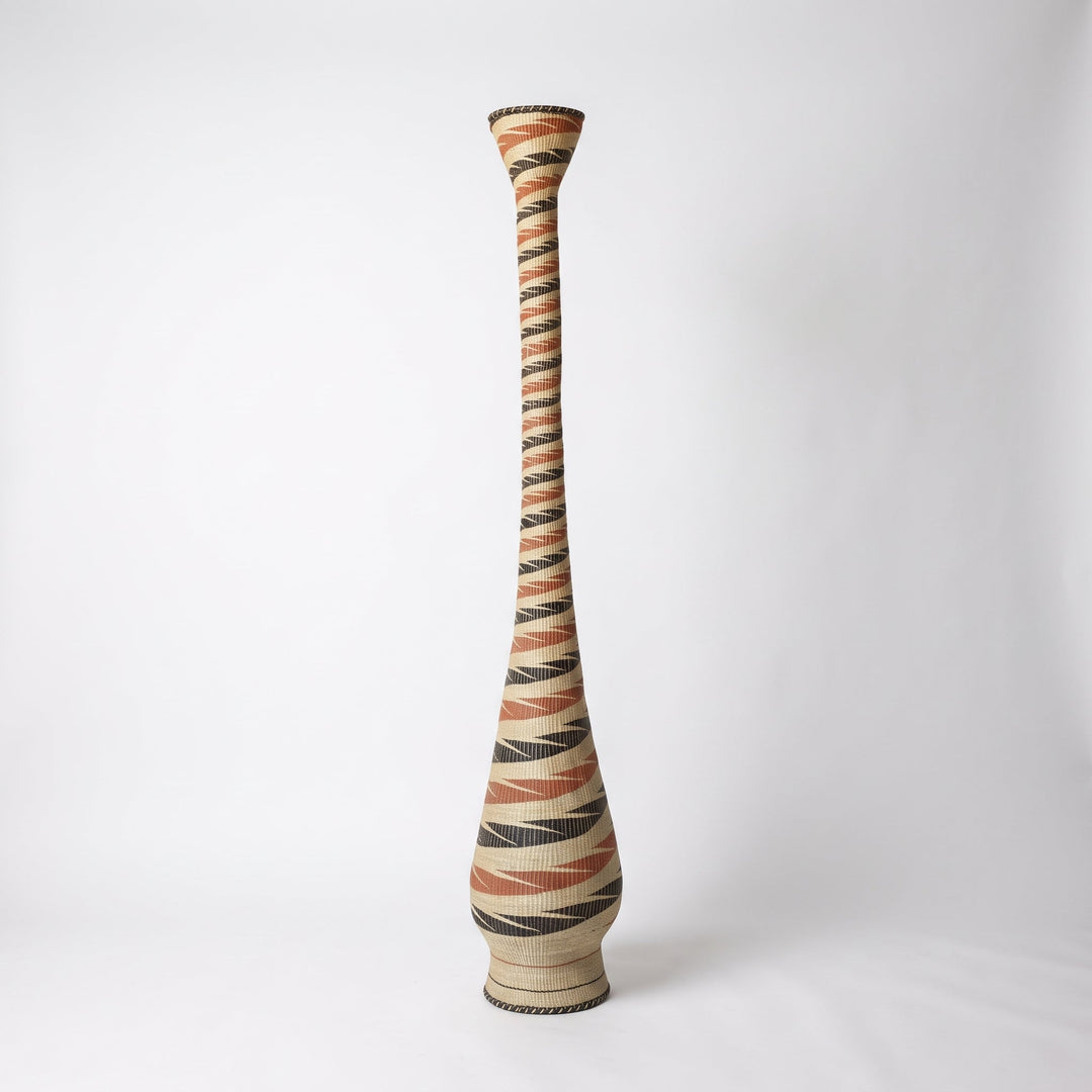 Terracotta and black ribbon spiral tower basket, alternate angle on soft white studio background