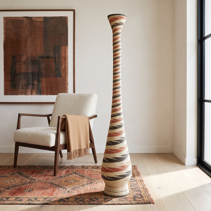 Terracotta and black ribbon spiral tower basket styled in a modern living room