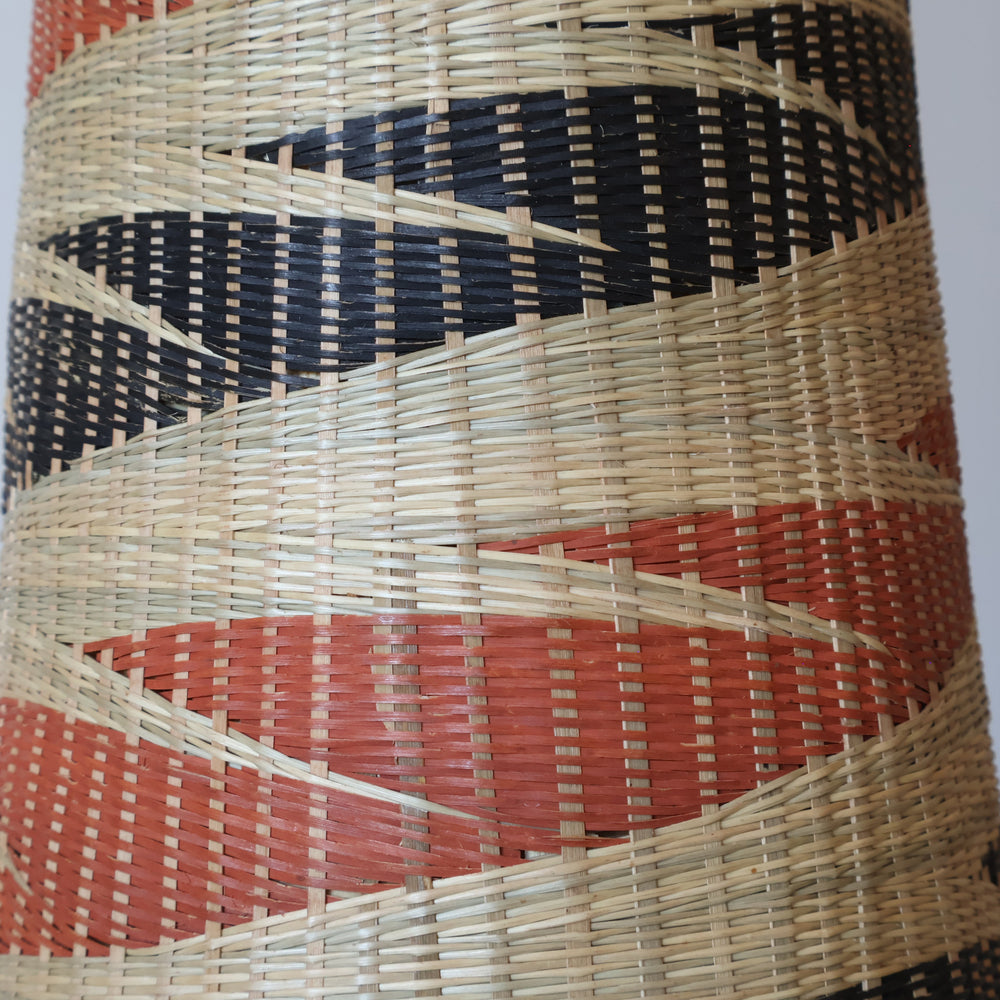 Close detail of the terracotta and black ribbons on the tower basket