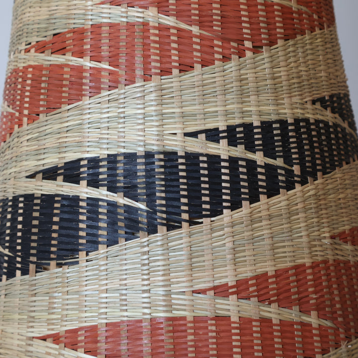 Close detail of the terracotta and black spiral ribbons on the tower basket