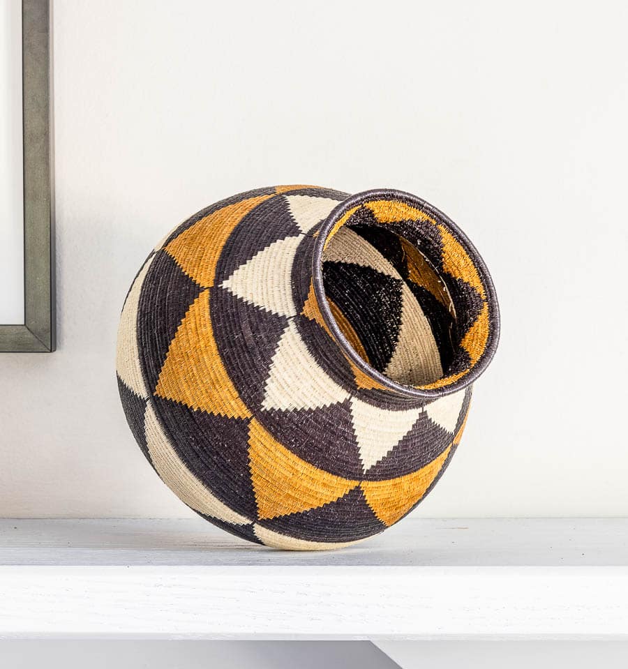Close-up geometric triangle weave detail palm fiber basket Wounaan craftsmanship