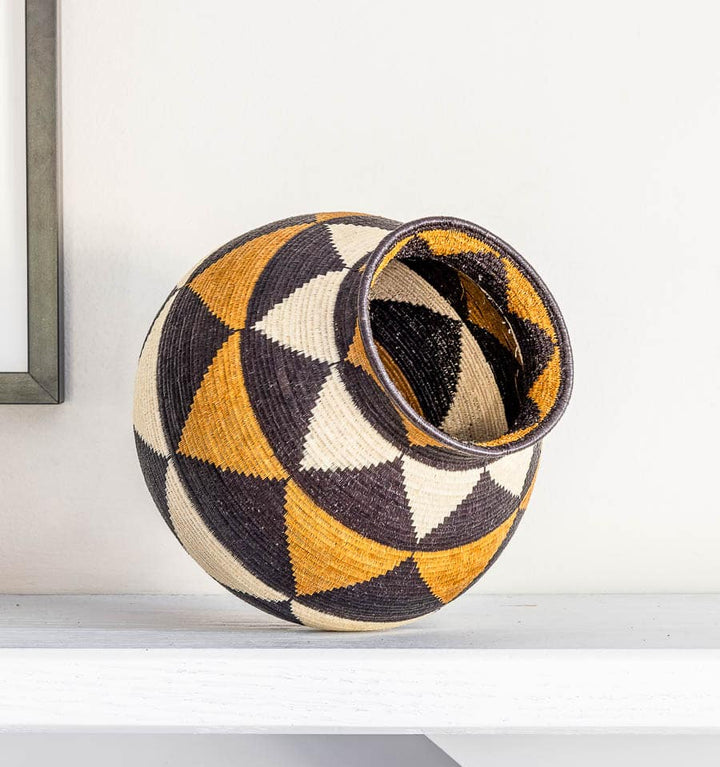 Close-up geometric triangle weave detail palm fiber basket Wounaan craftsmanship