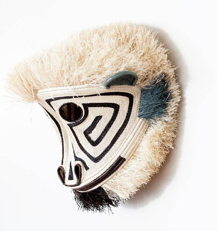 Side profile view of Embera white spirit monkey animal mask showing dimensional woven construction