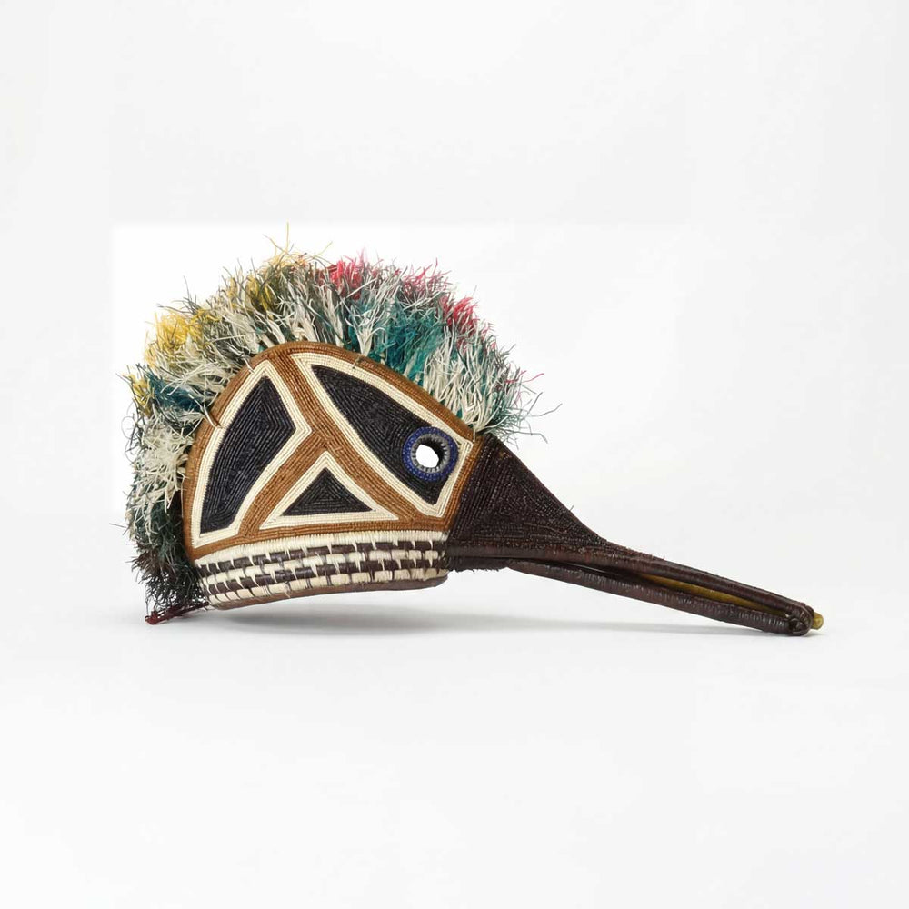 Intricate woven hummingbird animal mask by Embera artisans from Panama rainforest with palm fiber construction
