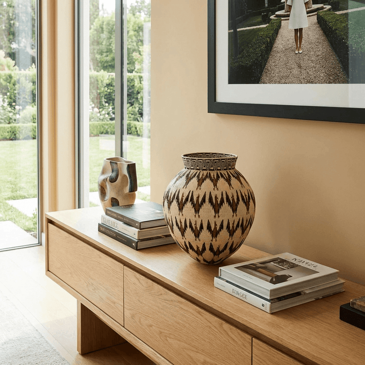 Wounaan eblinas bats basket displayed as boho consoledecor in modern interior setting