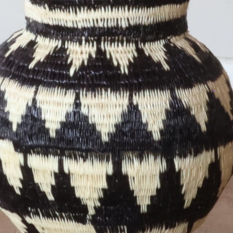 Close-up of tight werregue palm weave showing intricate ivory mountain peak pattern craftsmanship