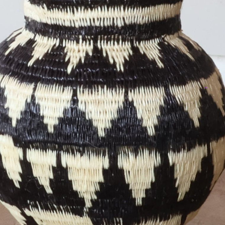 Close-up of tight werregue palm weave showing intricate ivory mountain peak pattern craftsmanship