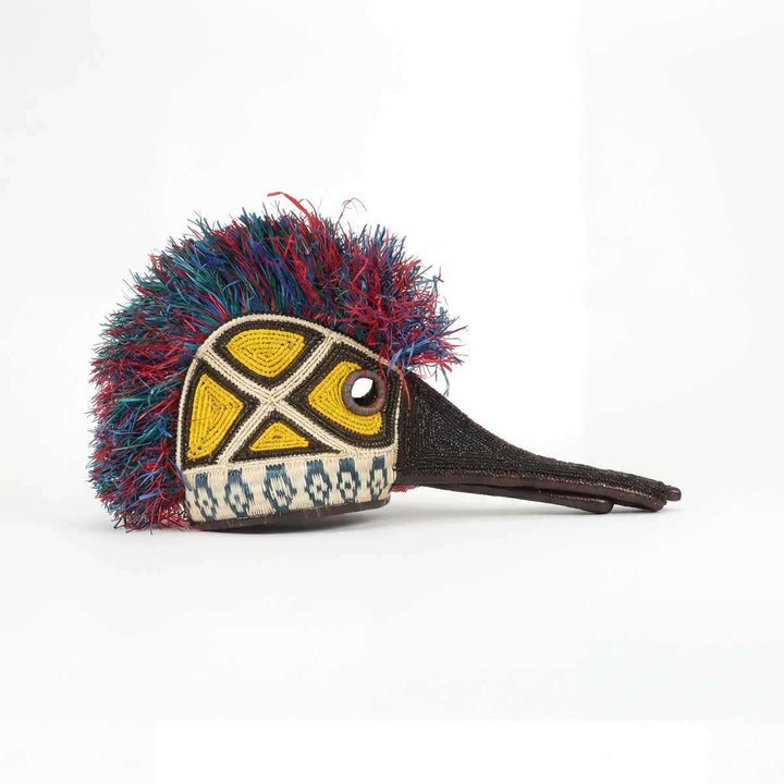 Embera hummingbird spirit mask with vibrant feather handwoven from Panama