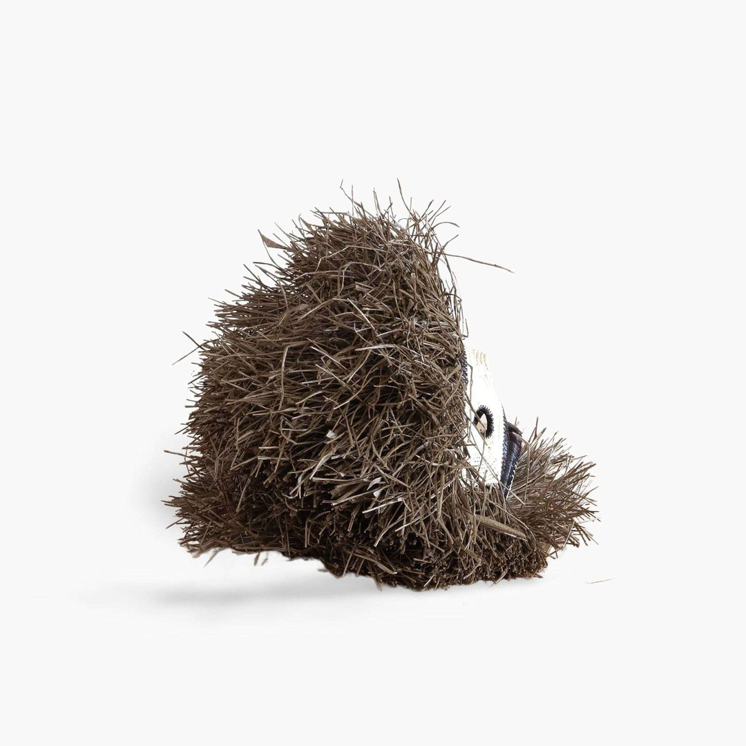 rear view showing dimensional palm fiber weaving of handmade monkey mask from Panama