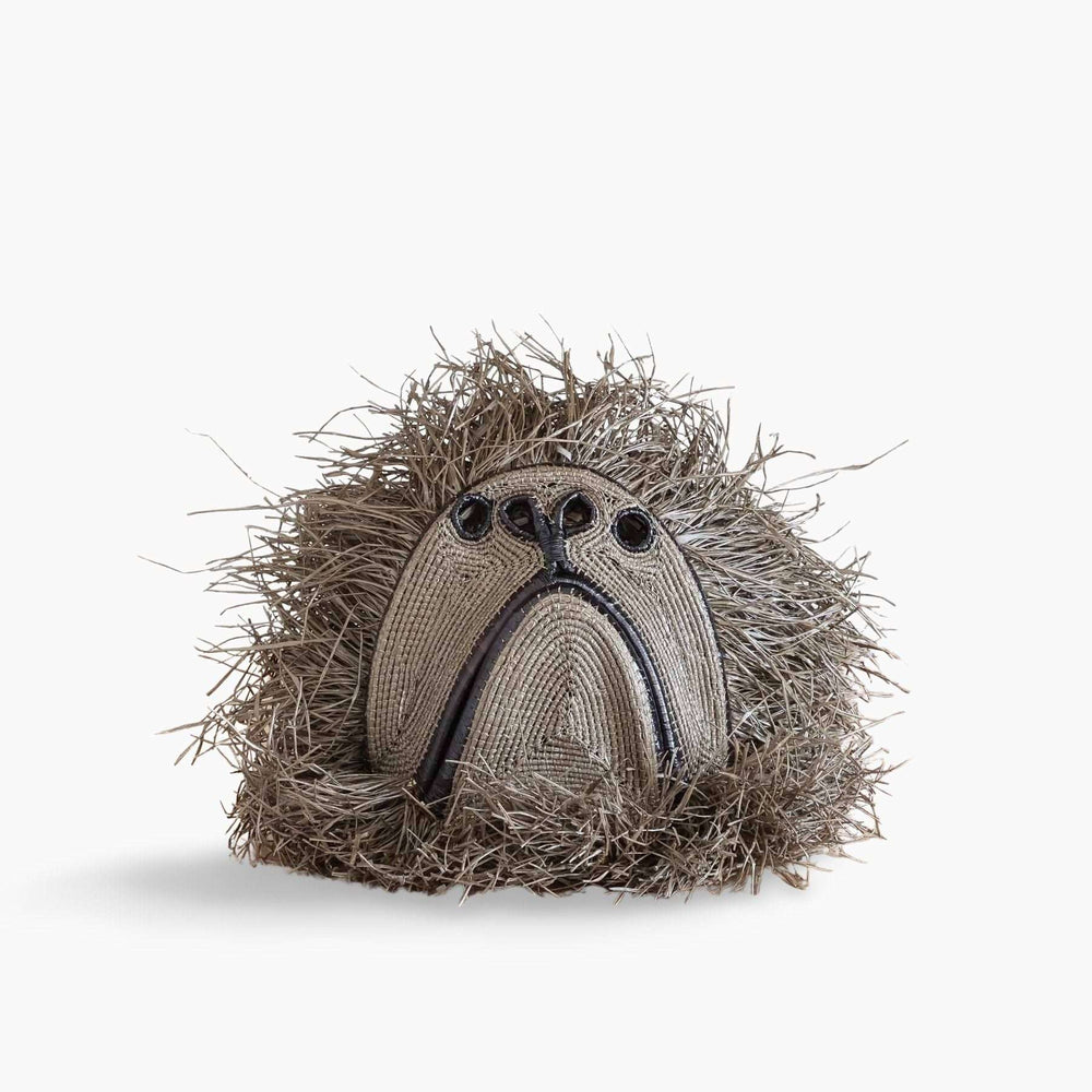 Handwoven monkey spirit mask in natural palm fiber by Embera artisans from Panama rainforest