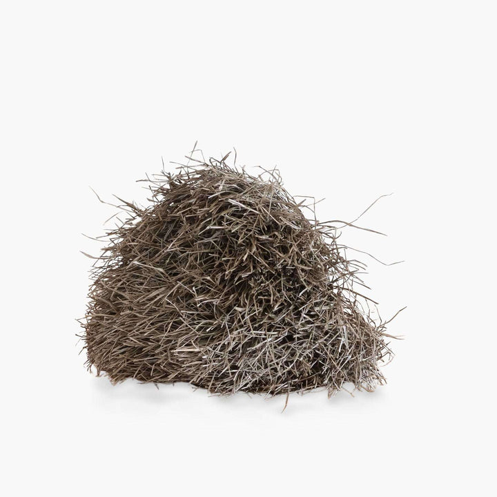 rear view of handmade palm leaf monkey mask showing three-dimensional craftsmanship