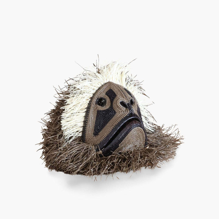 Handwoven monkey guardian mask in natural palm fiber by Embera artisans from Panama rainforest