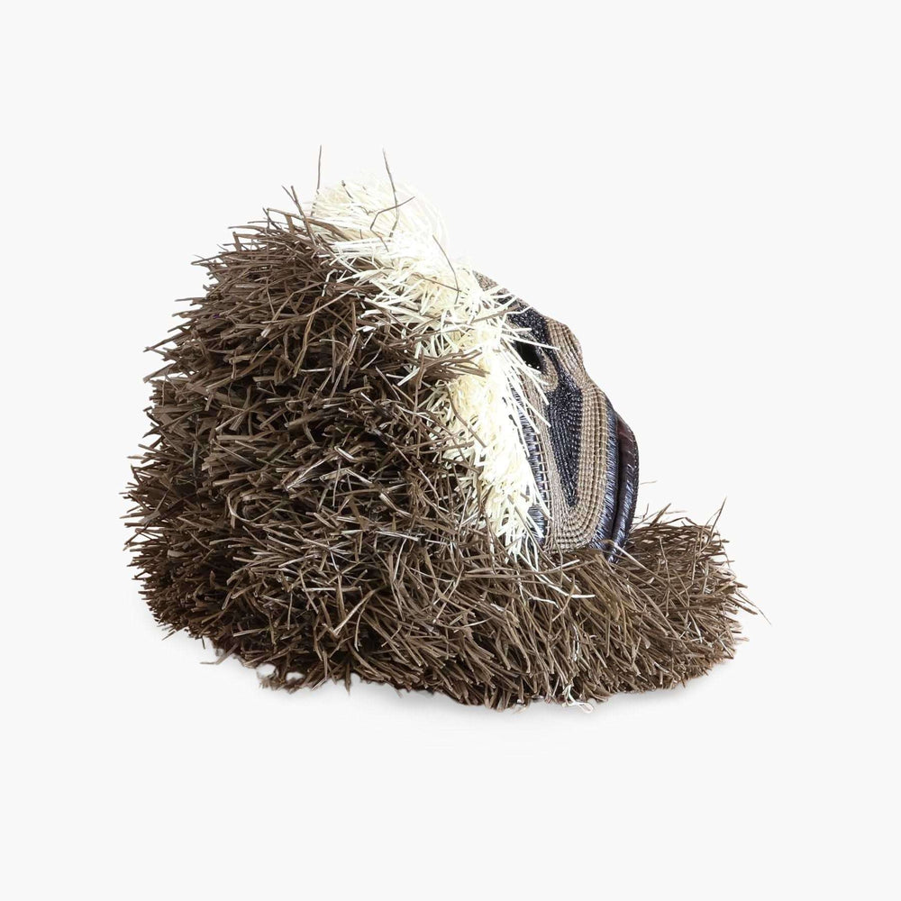rear view of dimensional handwoven palm leaf monkey mask showing sculptural depth
