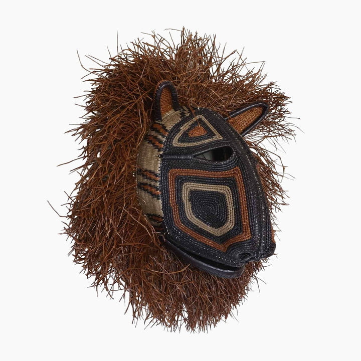 Side profile showing dimensional woven structure and palm fiber fringe detail