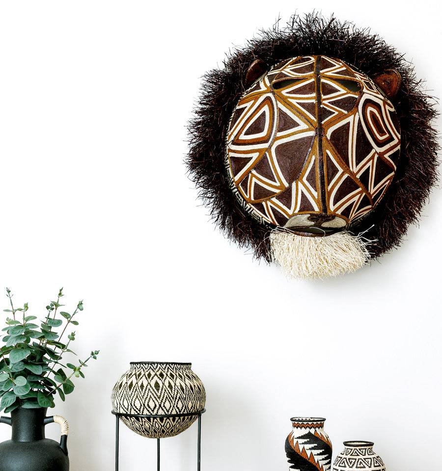 Geometric cat mask woven with palm fiber by Embera artisans from Panama's Darién rainforest