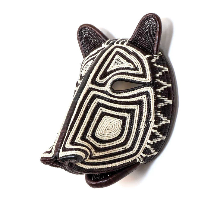Side angle of Embera woven cat mask in black and ivory fibers
