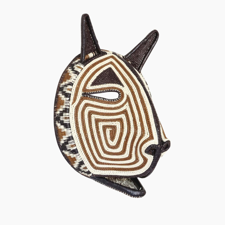 Side profile of handmade Embera ceremonial cat mask showing dimensional palm leaf construction