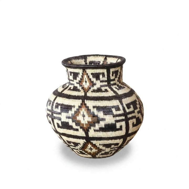 Handwoven Wounaan basket from Panama with espresso-and-ivory fret maze pattern and cinnamon diamond medallions