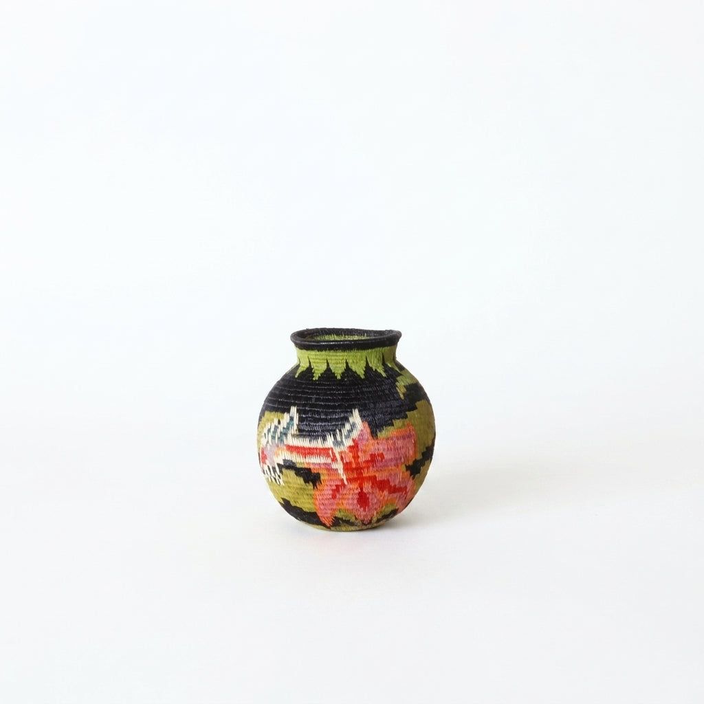 Handwoven Wounaan basket with coral pink lily and chartreuse leaf collar on black, mini woven art from Panama