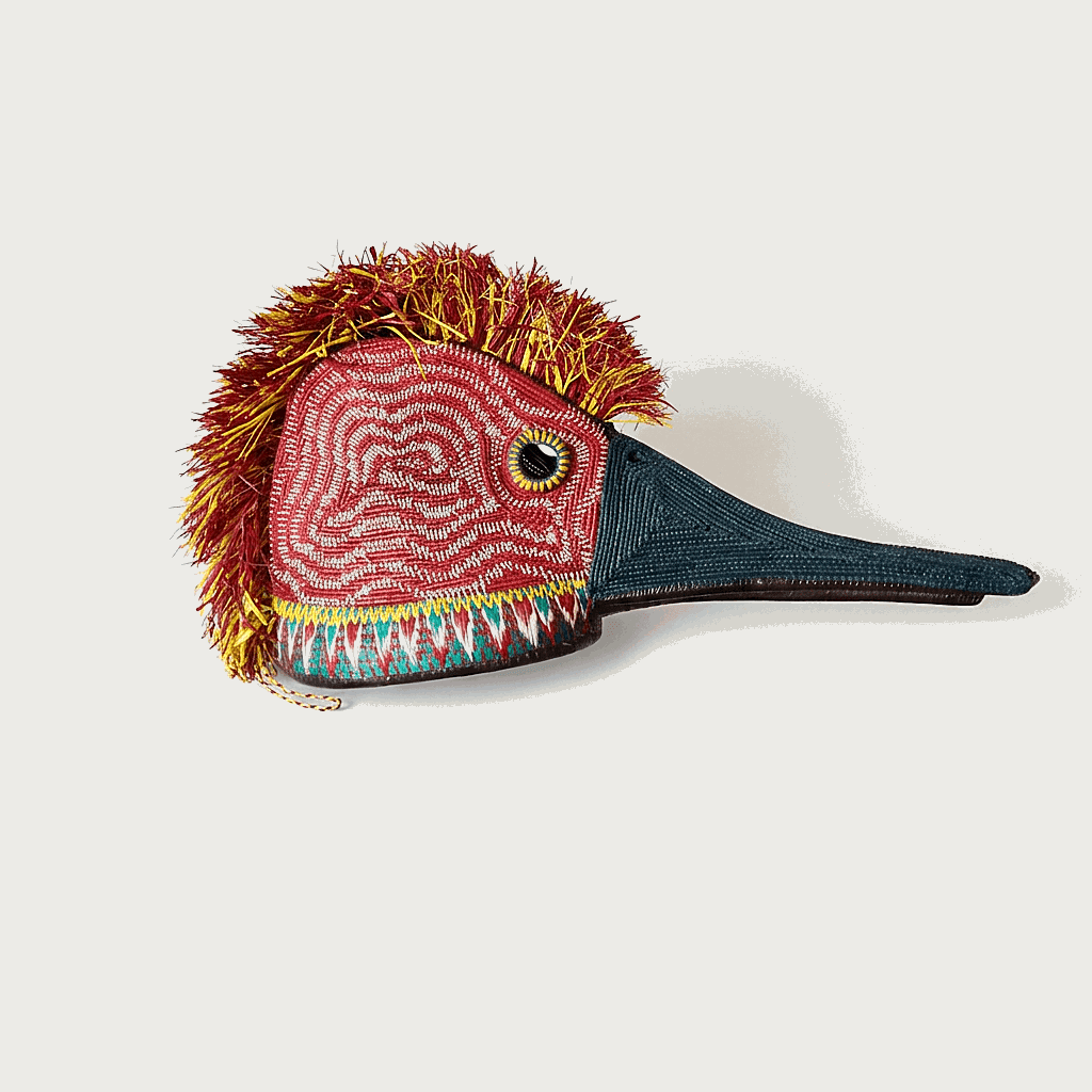 Red wavy hummingbird ceremonial mask handwoven palm fiber by Embera artisans from Panama Darién rainforest